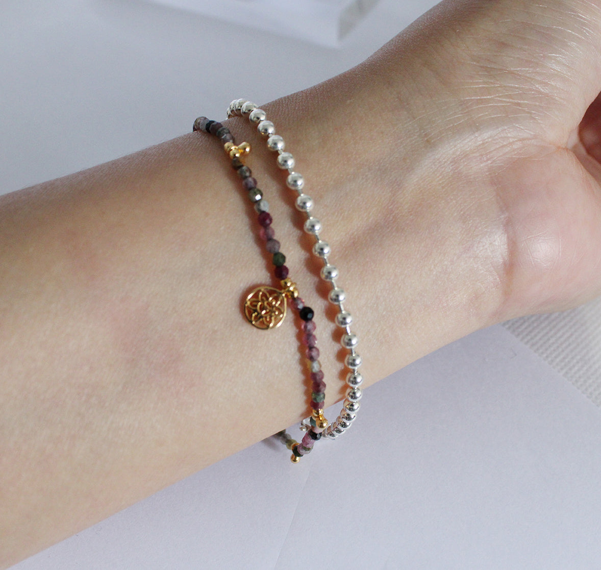 Brown Beaded Bracelet with Drop Beads and Atomic Charm