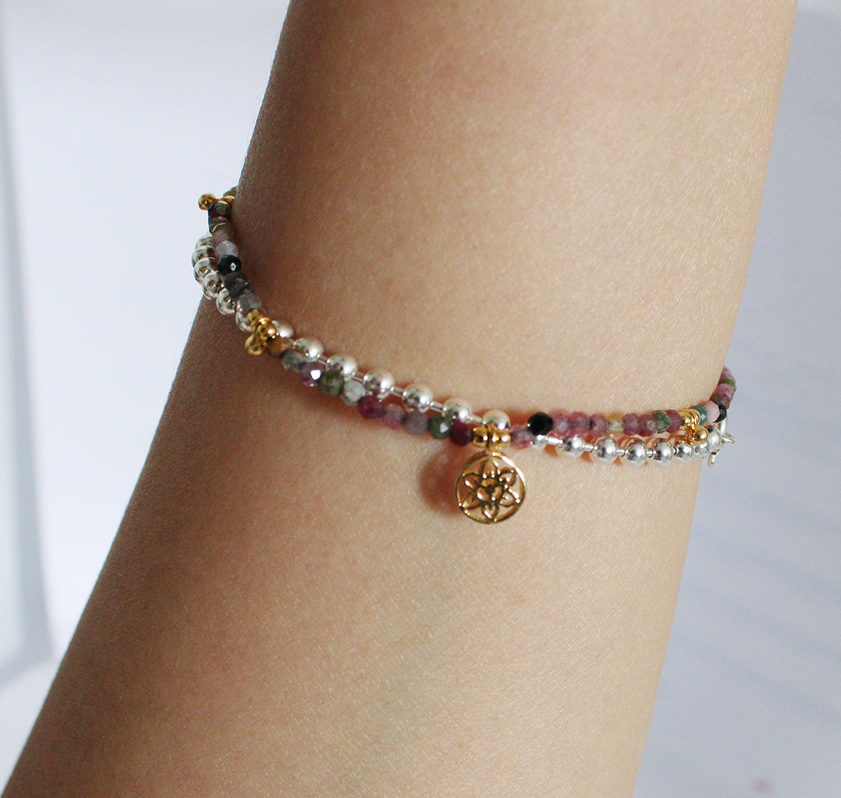 Brown Beaded Bracelet with Drop Beads and Atomic Charm