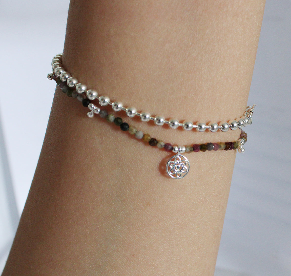 Brown Beaded Bracelet with Drop Beads and Atomic Charm